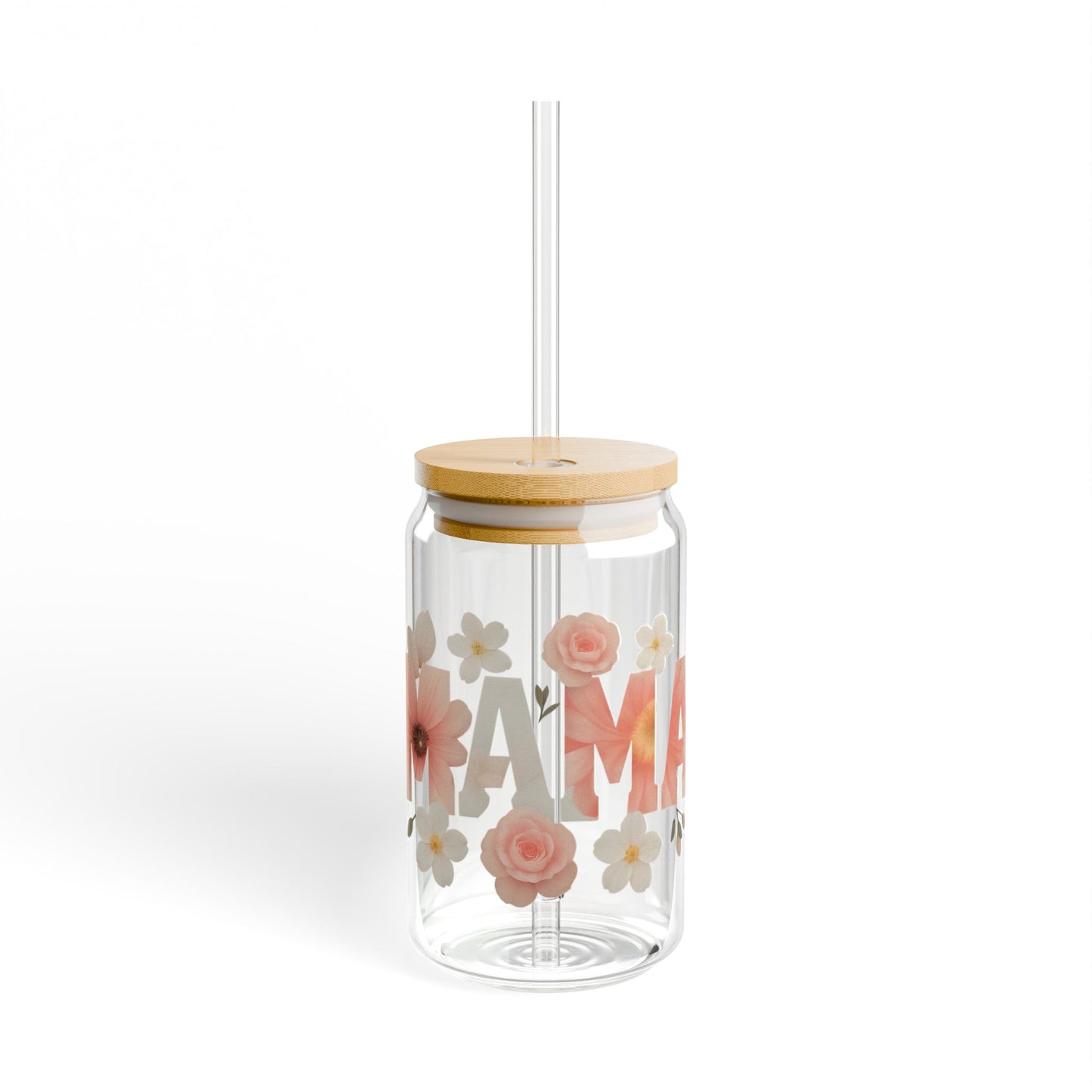 Clear glass can-style tumbler with bamboo lid and straw, featuring “MAMA” text in bold letters surrounded by soft pink and white floral illustrations