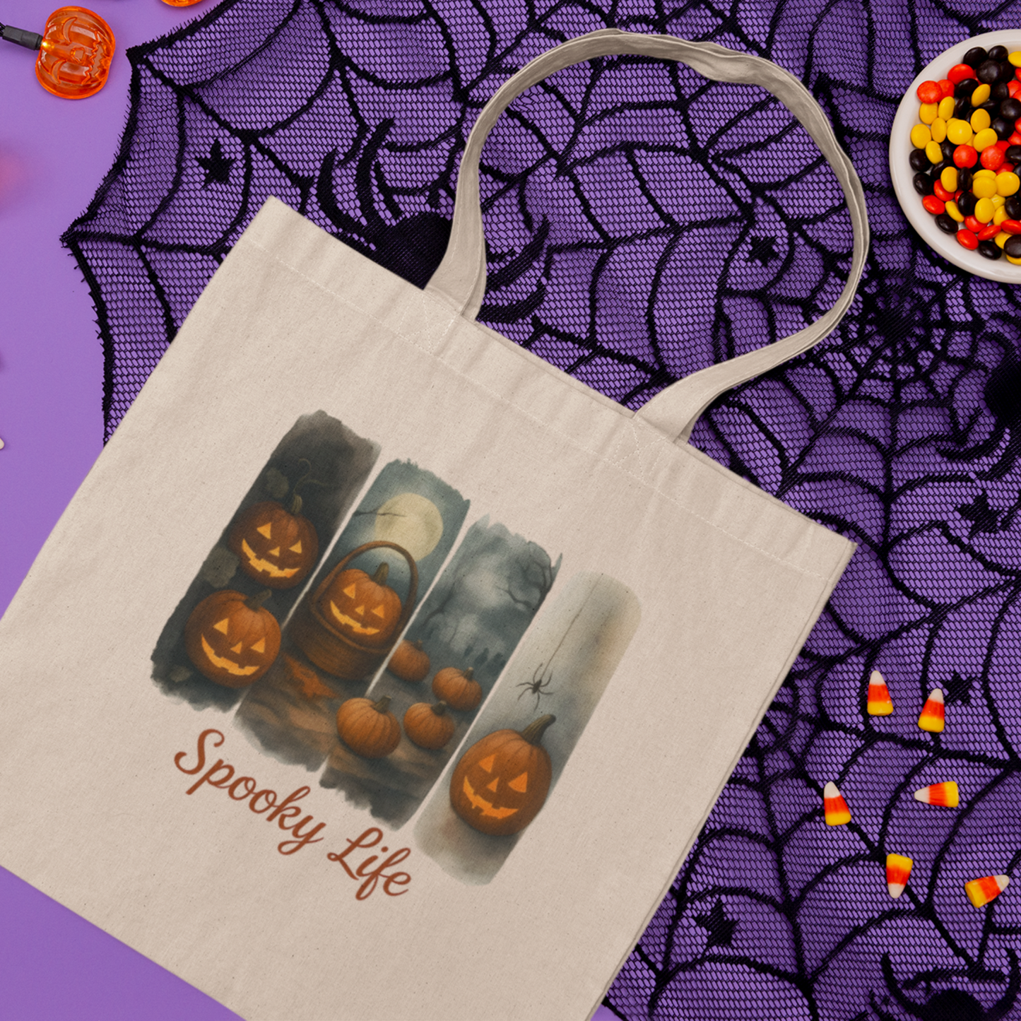 Tote bag with Halloween design and 'Spooky Life' text on a spider web background