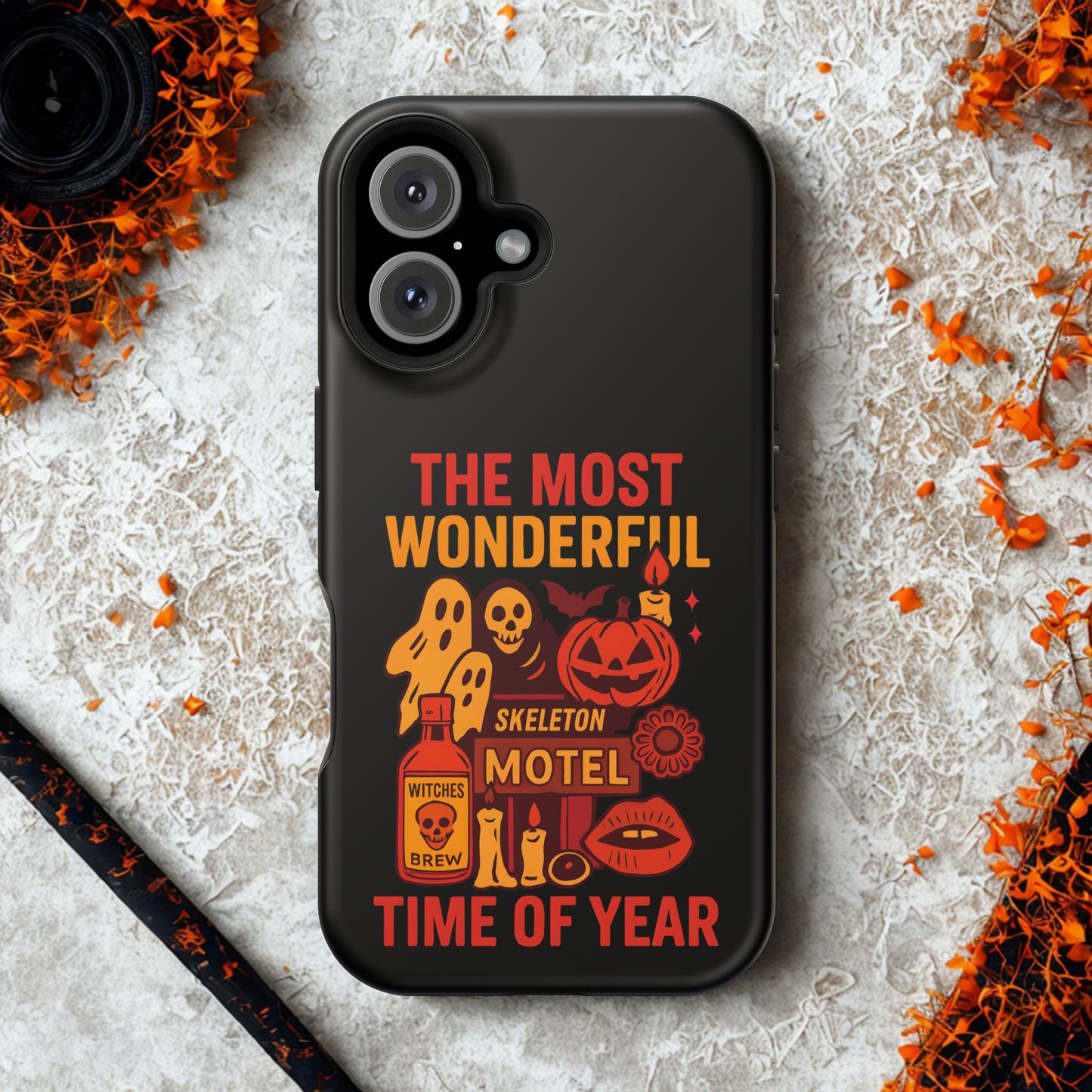 Black phone case with Halloween-themed design on a textured surface with decorative elements.